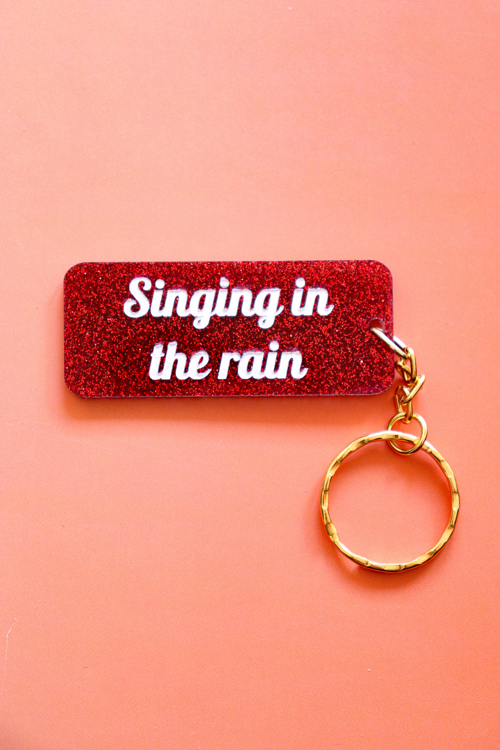 Porte clés à message - Singing in the rain