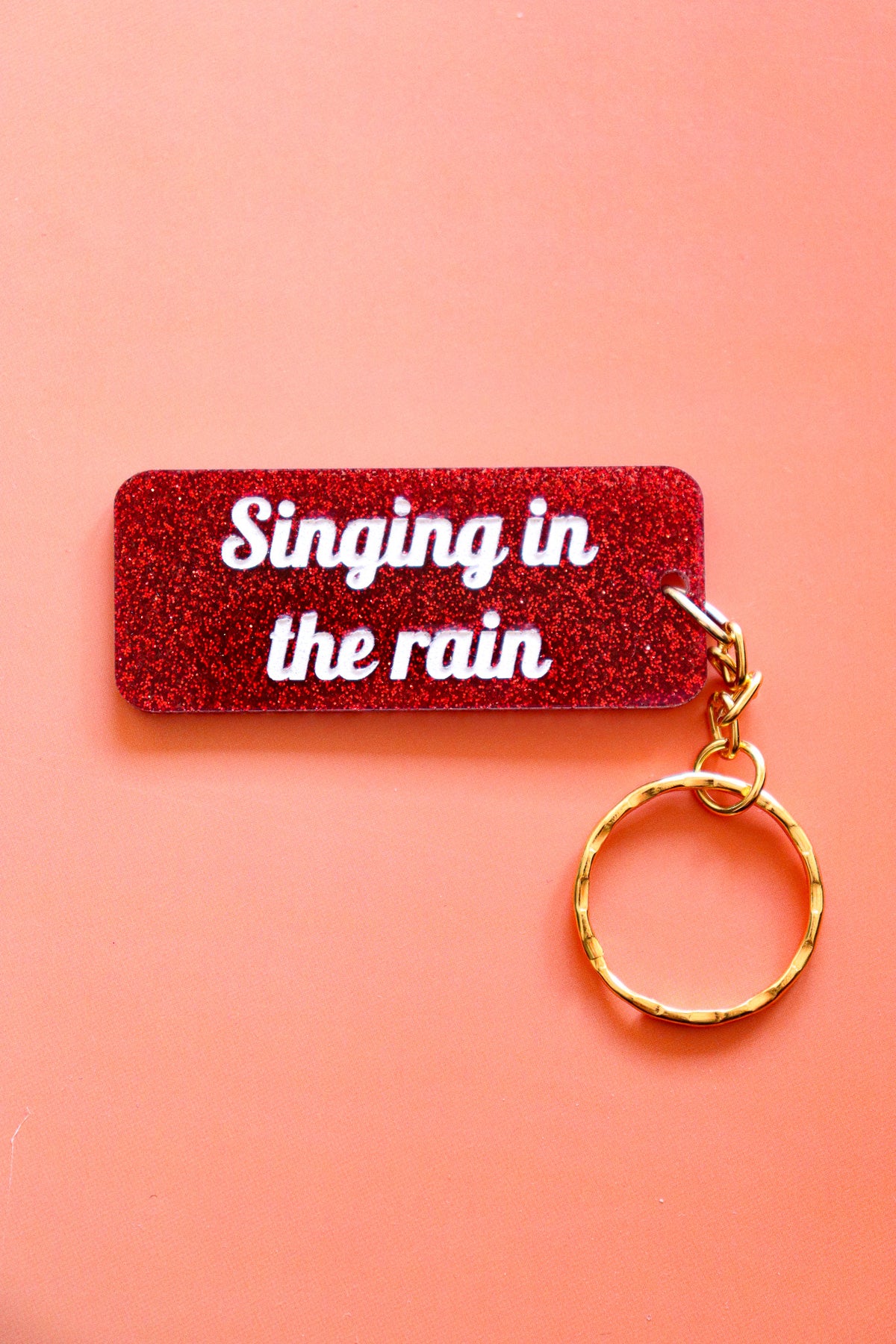 Porte clés à message - Singing in the rain